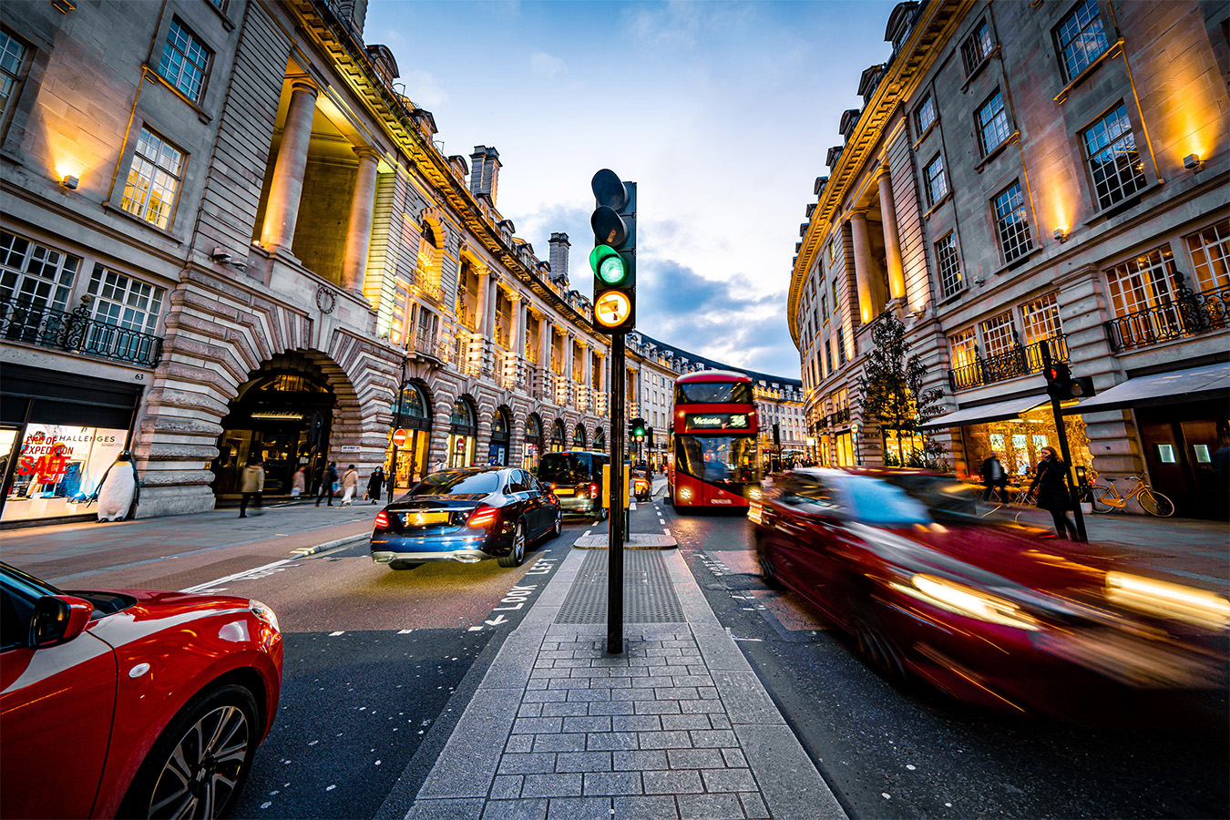 Image of moving traffic at dusk on Regent Street in London