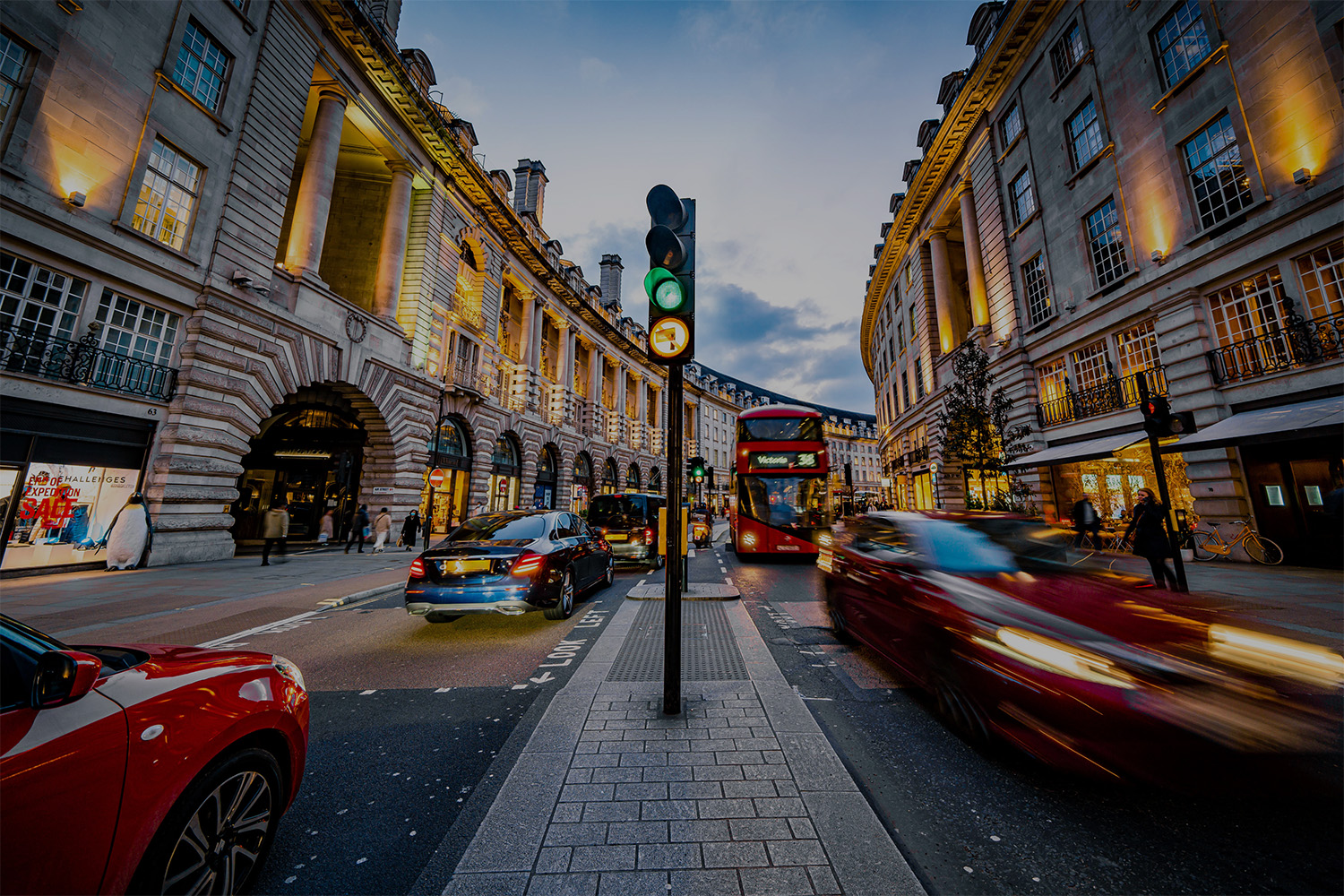 Image of moving traffic at dusk on Regent Street in London