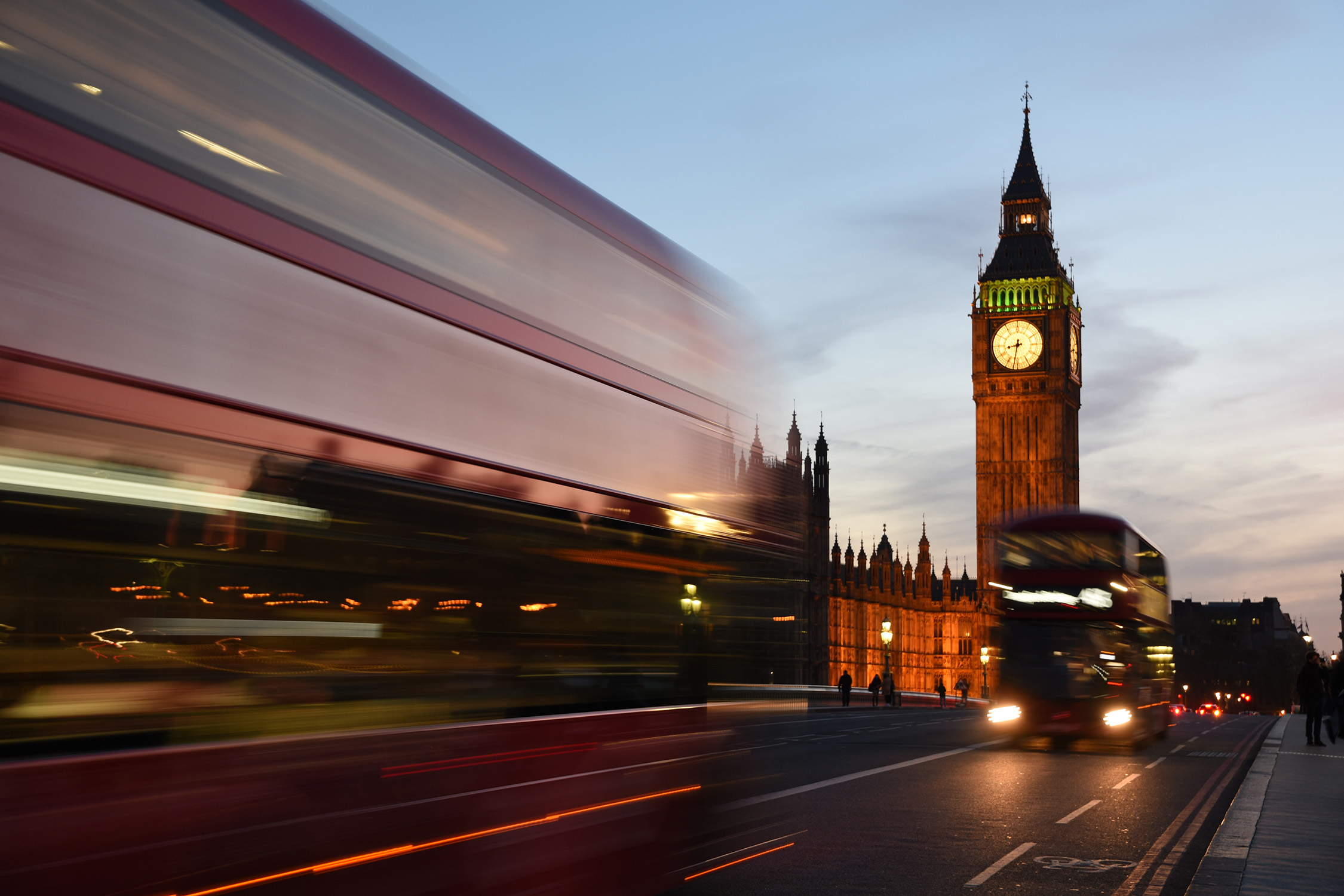 Image of Big Ben in London with bus in motion in foreground